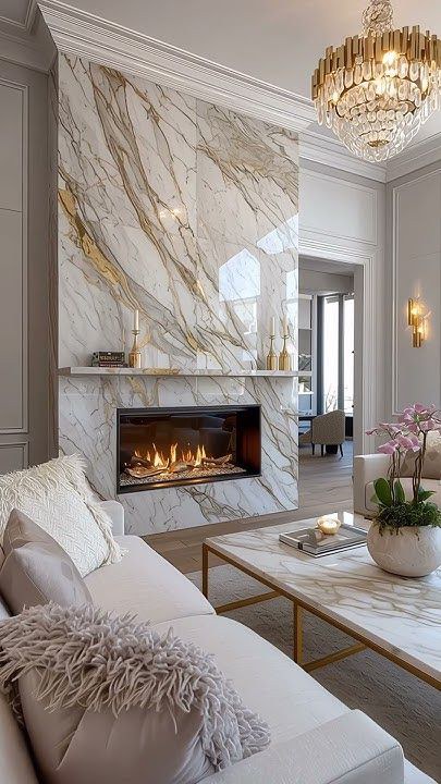 Living room with a gold veined Calacatta marble fireplace wall
