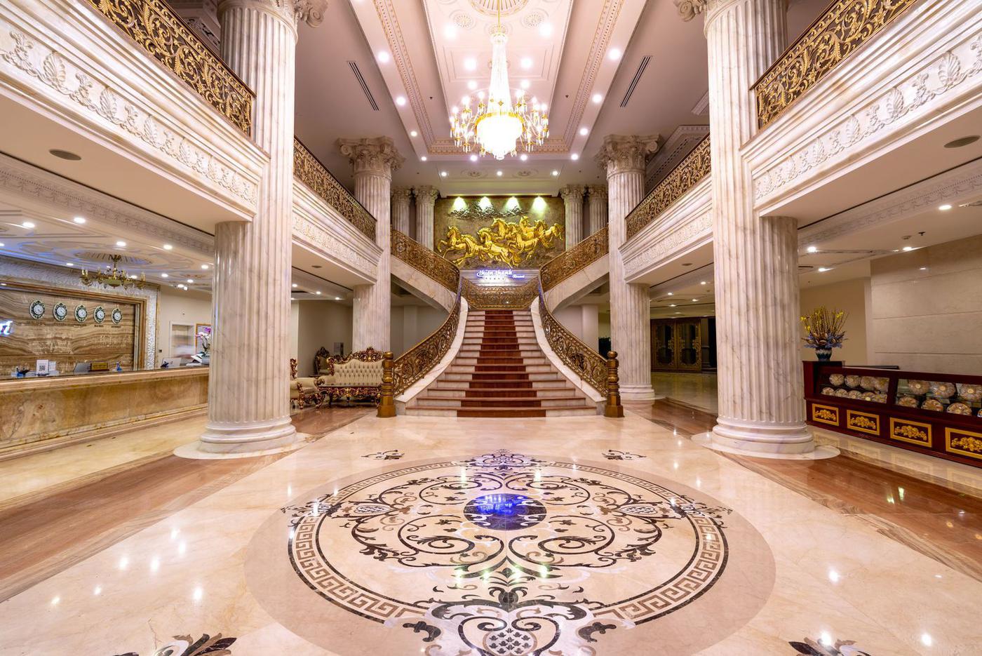Grand marble foyer with columns and staircase